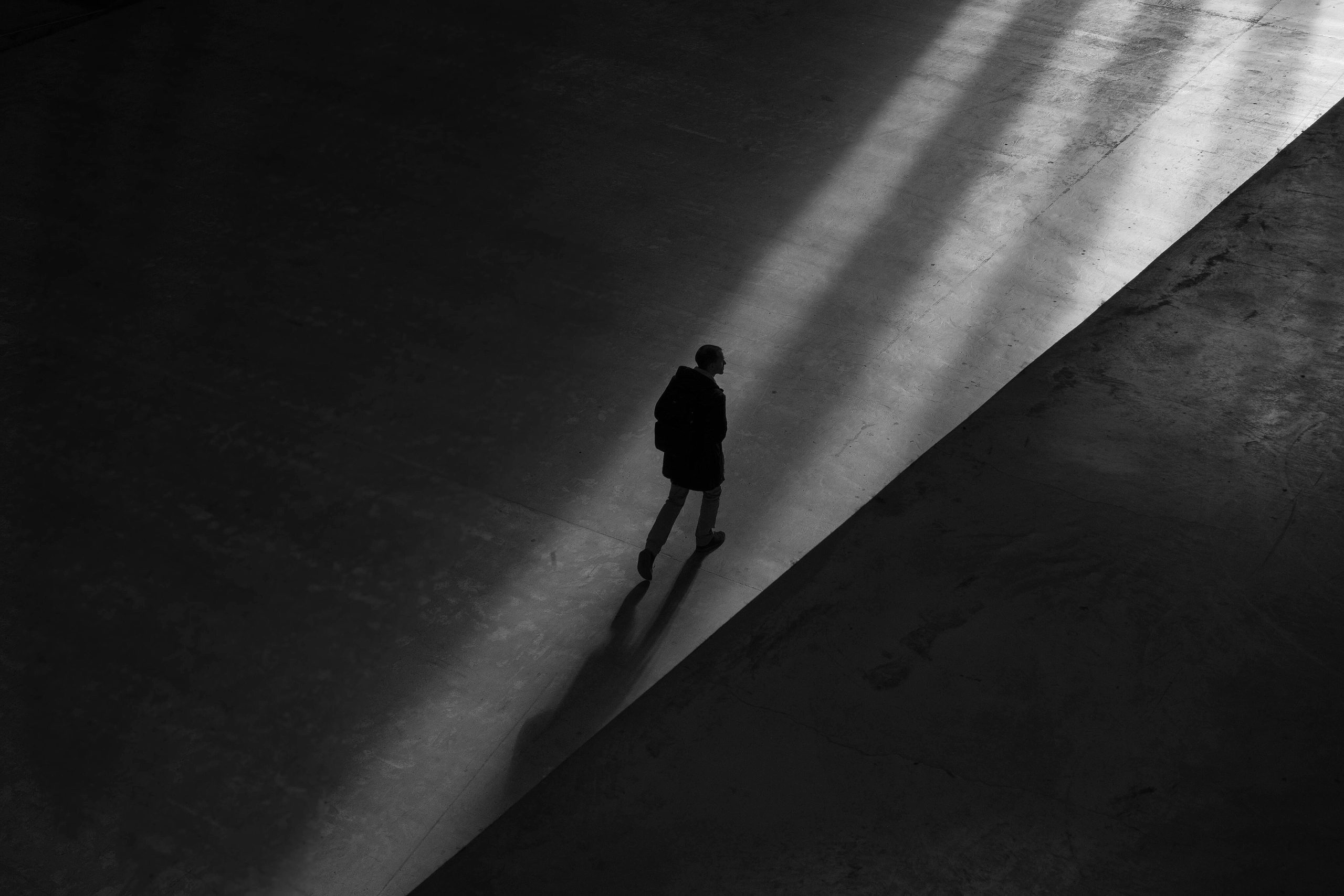 Silhouette walking away from light source
